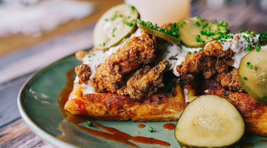 Tupelo Honey Southern Kitchen & Bar signature dishes  Southern, American.
Signature Dishes: Honey Dusted Fried Chicken, Shrimp and Grits, Famous Fried Green Tomatoes, Biscuits for a Cause (with blueberry jam and whipped butter).